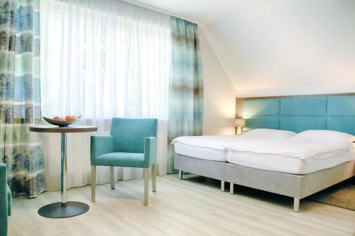Postel nebo postele na pokoji v ubytování Hotel zur Eiche