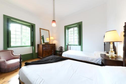 Tempat tidur dalam kamar di Quinta da Fogueira