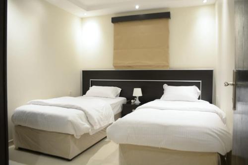 MJ Apartmentsにあるベッド