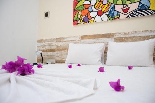 En eller flere senge i et værelse på Porto de Galinhas Yes Maria