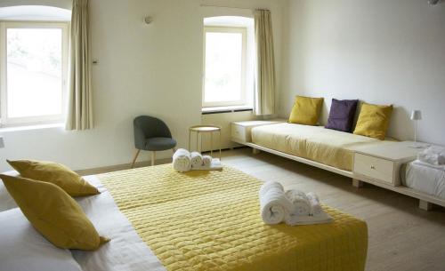 
a hotel room with two beds and a window at Agriturismo La Derta in Bellagio
