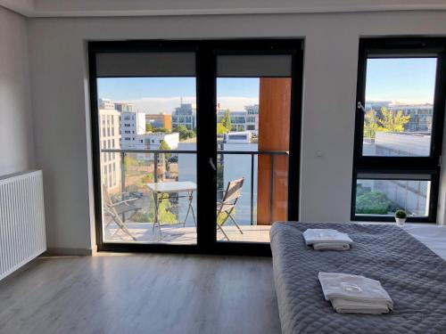 Posteľ alebo postele v izbe v ubytovaní Living Point Residence