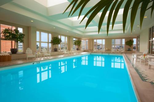a large pool with blue water in a hotel lobby at Seaport Hotel® Boston in Boston