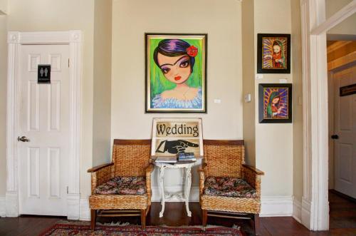 a room with two chairs and a painting on the wall at Inn on the Riverwalk in San Antonio