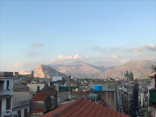 a view of a city with mountains in the background at Cappuccini Green Relax in Carini