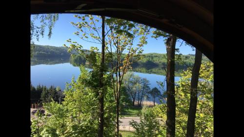 a view of a lake from a window at Rozalin in Ostrzyce