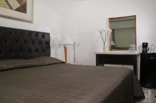Postel nebo postele na pokoji v ubytování Hotel America Palacio