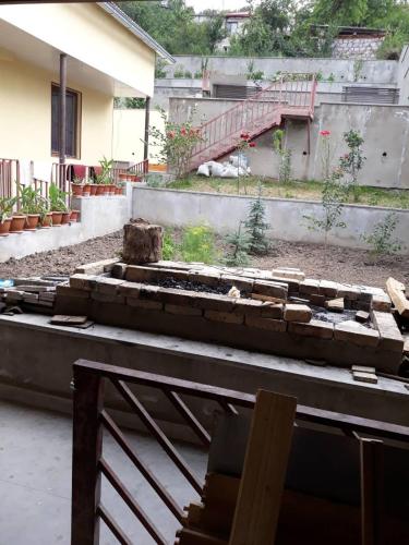 a view of a garden with a building at GuestHouse M22 in Dilijan