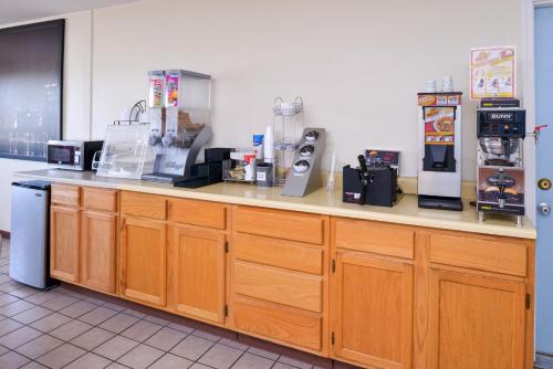 a kitchen with a counter with a coffee maker at Americas Best Value Inn Sullivan in Sullivan