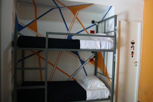 Ένα ή περισσότερα κρεβάτια σε δωμάτιο στο Antonieta Hostel