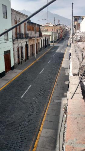 an empty street in a city with buildings at Casona de Sillar in Arequipa