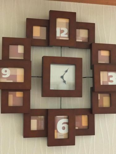 a wall with a picture frame with a bird on it at Fureai No Yado Yasuragi in Nozawa Onsen