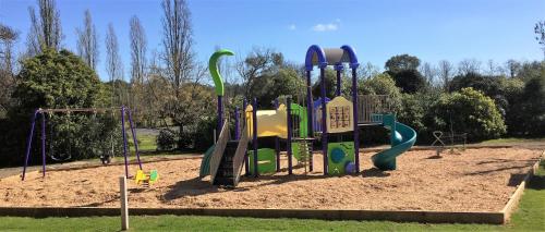 a playground in a park with a play equipment at BIG4 Wangaratta North Cedars Holiday Park in Wangaratta