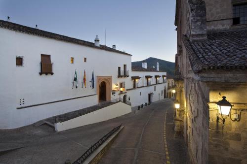 an alley in a town with white buildings and a street at Parador de Guadalupe in Guadalupe