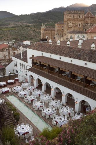 a view of a building with tables and chairs at Parador de Guadalupe in Guadalupe