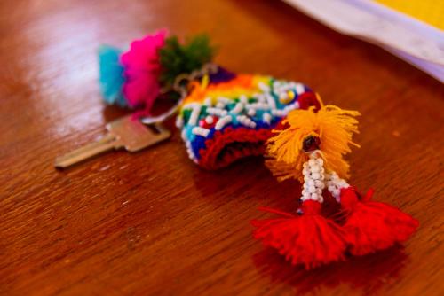 a knitted object on a wooden table at Peru Quechua's Lodge Ollantaytambo in Ollantaytambo