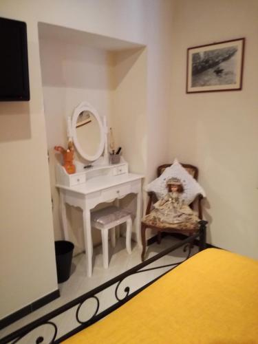 a bathroom with a sink and a mirror at Nonna Anna in Siena