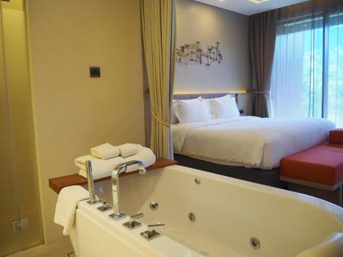 Ein Bett oder Betten in einem Zimmer der Unterkunft dusitD2 Khao Yai