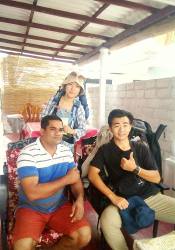 a group of three people sitting in a room at Gloriya Mathews in Negombo