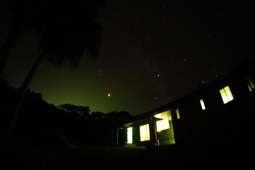 a night view of a house with a green sky at Yakunoyado Taguchi in Yakushima