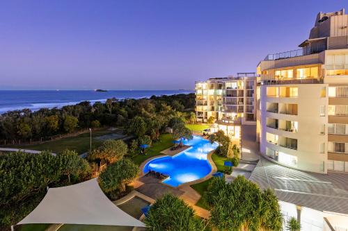 an aerial view of a resort with a swimming pool at Ramada By Wyndham Marcoola Beach in Marcoola