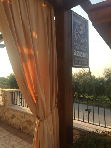 a curtain in front of a window with a sign at San Michele in Foglianise
