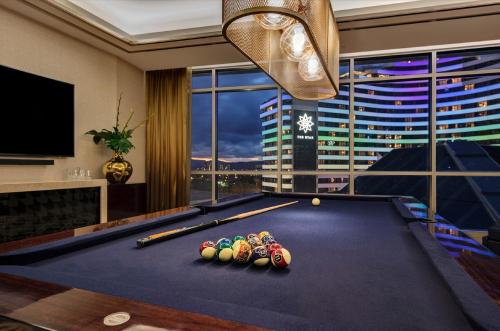 a billiard room with a pool table with balls on it at The Darling at The Star Gold Coast in Gold Coast