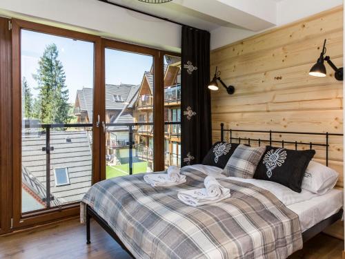 Posteľ alebo postele v izbe v ubytovaní Polana Szymoszkowa Ski Resort - Mountain View Apartments