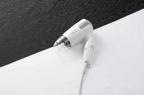 a white electric toothbrush sitting on top of a counter at APA Hotel Sagaeki Minamiguchi in Saga