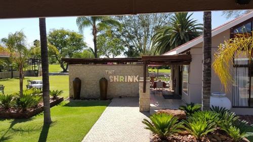 a building with a sign that reads the sprinkles at Machauka Lodge in Lephalale