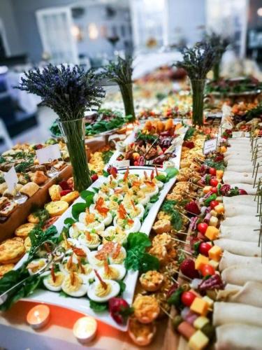 a long buffet of food on a table at Machauka Lodge in Lephalale