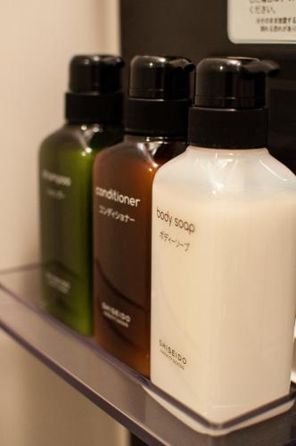 a shelf with three bottles of soap on it at e-stay ebisu in Osaka