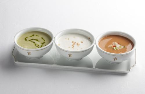 three bowls of soup on a plate on a tray at Parador de Guadalupe in Guadalupe