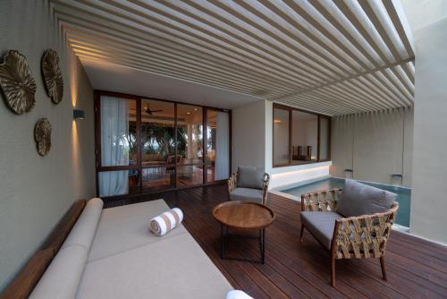 a living room with a couch and a table at Le Grand Galle in Galle
