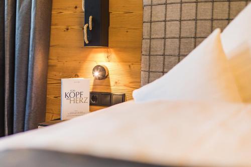 a close up of a bed in a hotel room at DAS VIER Sport,- und Wellnesshotel in Sankt Leonhard im Pitztal