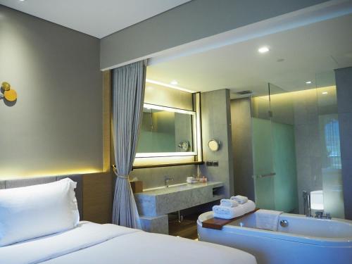 Ein Bett oder Betten in einem Zimmer der Unterkunft dusitD2 Khao Yai