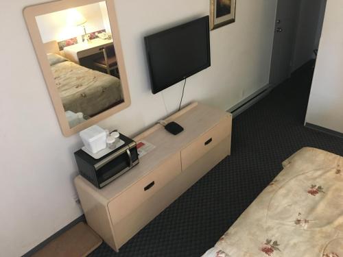Postel nebo postele na pokoji v ubytování DC Lodge