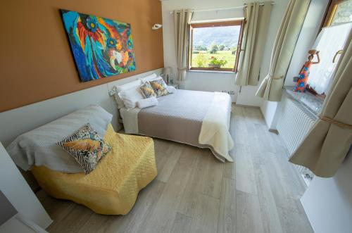 Ένα ή περισσότερα κρεβάτια σε δωμάτιο στο B&B Pousada Rio Aosta-servizi di Bed and breakfast