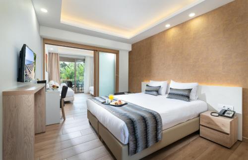 Katil atau katil-katil dalam bilik di Poseidon Hotel Sea Resort