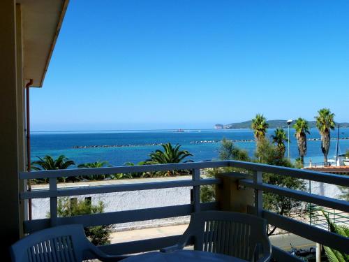 a view of the beach from a balcony at Residence Buganvillea in Alghero