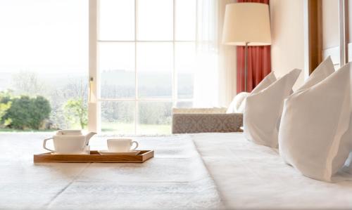 Ένα ή περισσότερα κρεβάτια σε δωμάτιο στο Adler Spa Resort Thermae