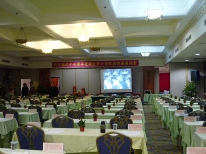 a large room with tables and chairs and a screen at Life Leisure Resort in Guanxi