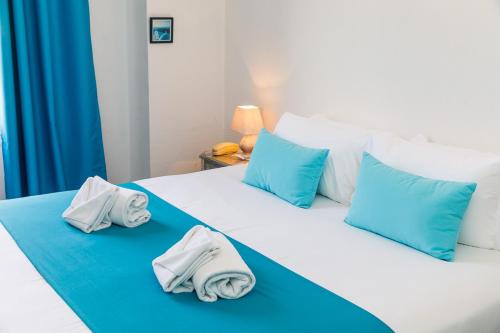 Ένα ή περισσότερα κρεβάτια σε δωμάτιο στο Hôtel Les Liserons de Mougins