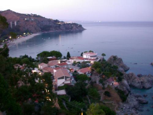 a town on a hill in the middle of the water at Borgo Medievale Squillace in Squillace