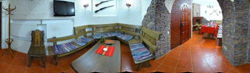 a play room with a wooden table in a building at Medzhybozhskiy Zamok in Tribukhovtsy