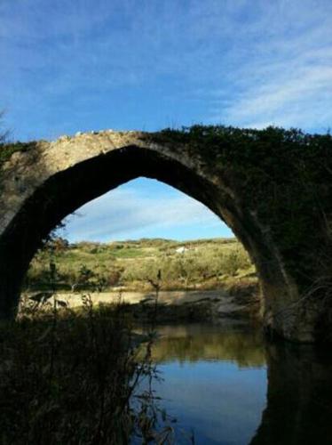 a stone bridge over a body of water at Borgo Medievale Squillace in Squillace