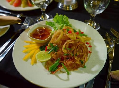 a white plate of food on a table at Serendiva Beach in Wadduwa