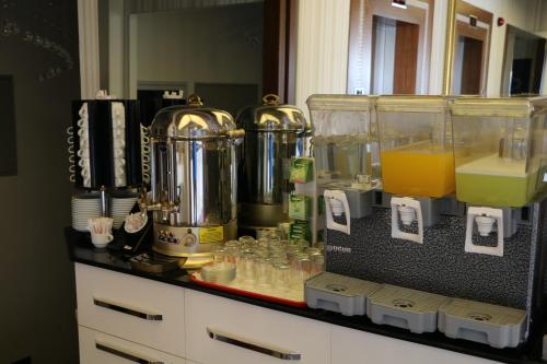 a counter with a bunch of different items on it at Business Grand Hotel in Ankara