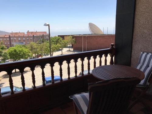 a balcony with a table and chairs and a view of a building at Il Sogno di Gio de la Laguna in La Laguna
