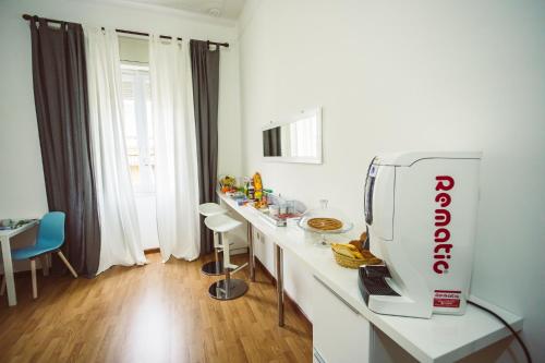 a kitchen with a counter with a food processor on it at Bluemoon Sardinia in Cagliari